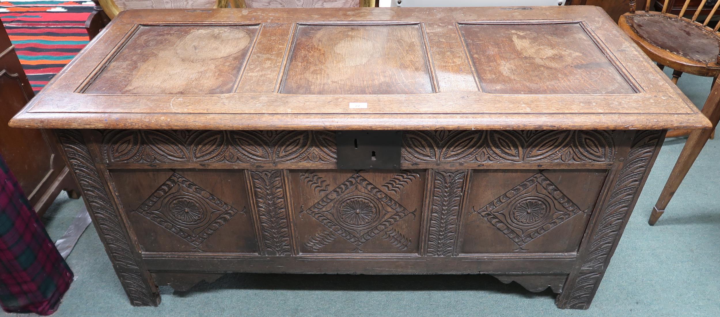 An 18th century oak blanket chest with carved panel front, 71cm high x 151cm wide x 63cm deep - Image 2 of 3