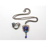 A silver James Fenton, enamelled pendant, and a enamelled (af) Art Nouveau brooch Condition Report: