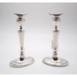 A pair of silver neo-classical style candlesticks, by D J Silver Repairs, London 1966, of navette