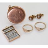 A 9ct rose gold locket, two children's signet rings, and a pair of cz earrings, weight together 6.