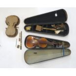 A lot consisting of part violins and wooden coffin violin cases and a penny whistle Condition