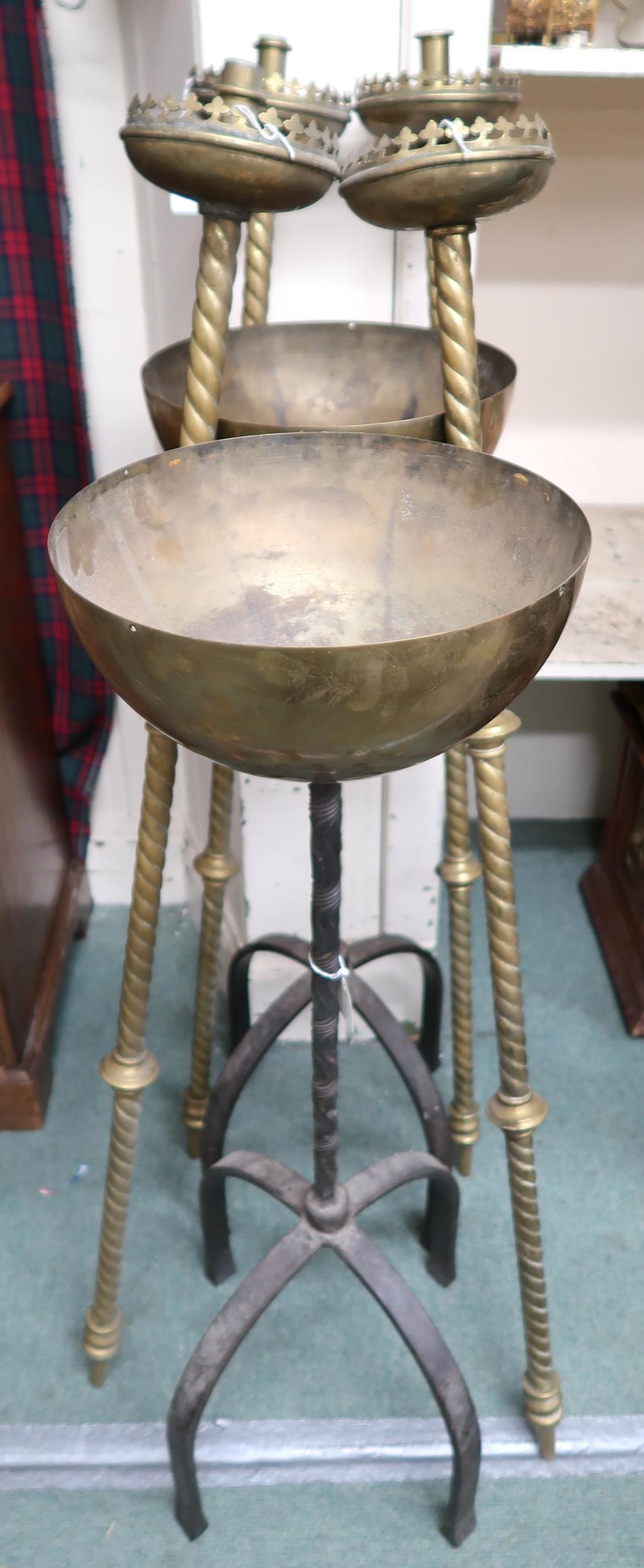 A set of four 20th century brass ecclesiastical procession candle holders and a pair of brass and