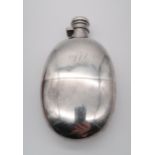 A late Victorian silver hip flask, by Sampson Mordan & Co, London 1892, of oval form, engraved
