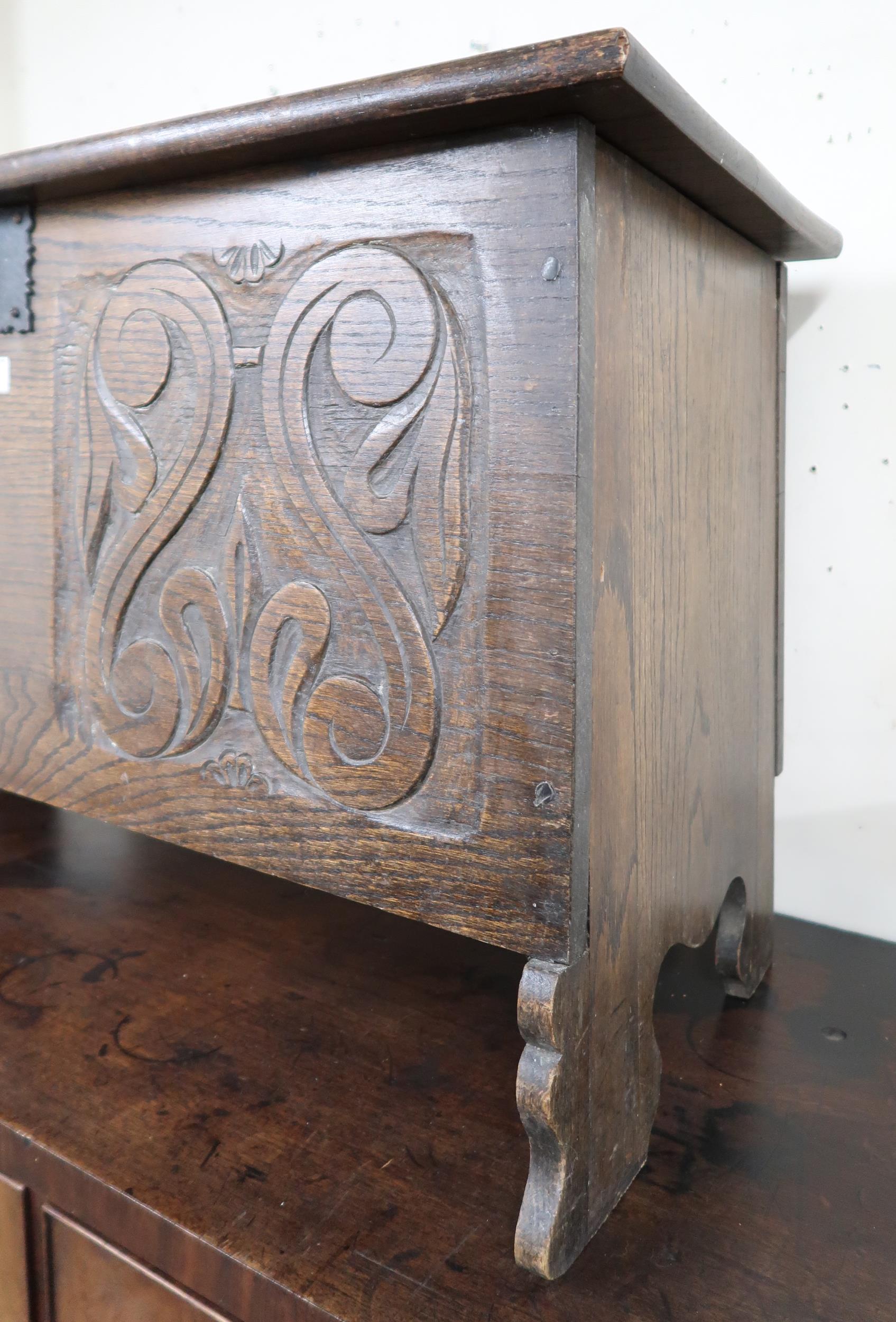 A 20th century oak kist with carved front panel, 56cm high x 91cm wide x 42cm deep Condition - Image 3 of 4
