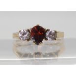 A 9ct gold pear shaped garnet and cubic zircona ring, size P1/2, weight 3.4gms Condition Report: