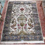 A 20th century wool tree of life pattern rugs with floral foliate border, 227cm long x 170cm wide