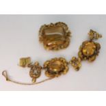 A collection of yellow metal filligree brooch and a partial decorative bracelet with continental
