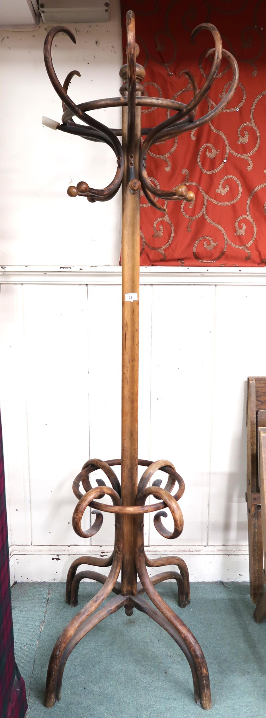 A Victorian bentwood coat stand with scrolled quadrupedal base, 197cm high Condition Report: