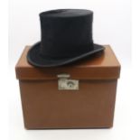 A silk top hat, generous size, by Carswell of Glasgow, in fitted leather case, internal measurements