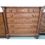 A Victorian mahogany chest of drawers with three short over four long drawers flanked by columns