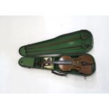 A two piece back violin 35.5cm bearing label to the interior together with a case and two bows
