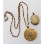 A large circular well engraved yellow metal locket, either gold cased or thickly rolled gold,