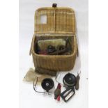 FISHING TACKLE A wicker creel, containing a variety of reels, lines, etc. Condition Report:Available