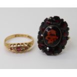 An 18ct red gem  and diamond accent ring, size L1/2 weight 1.7gms, and a yellow and white metal