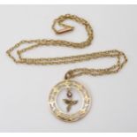 A 9ct gold leaf themed pendant set with a pink gem and pearls, diameter 2.4cm, on a 9ct gold vintage