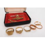 A 9ct gold signet ring, P1/2, buckle ring R1/2, a further two rose gold wedding rings, brooch and