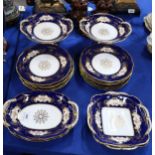 A Coalport dessert service decorated with panels of flowers Condition Report:Available upon request
