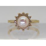 An 18ct gold pearl and cubic zircona ring, size O1/2, weight 3.7gms Condition Report:Available