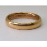An 18ct gold court wedding ring, hallmarked Birmingham 1850, size Q1/2, weight 6gms Condition