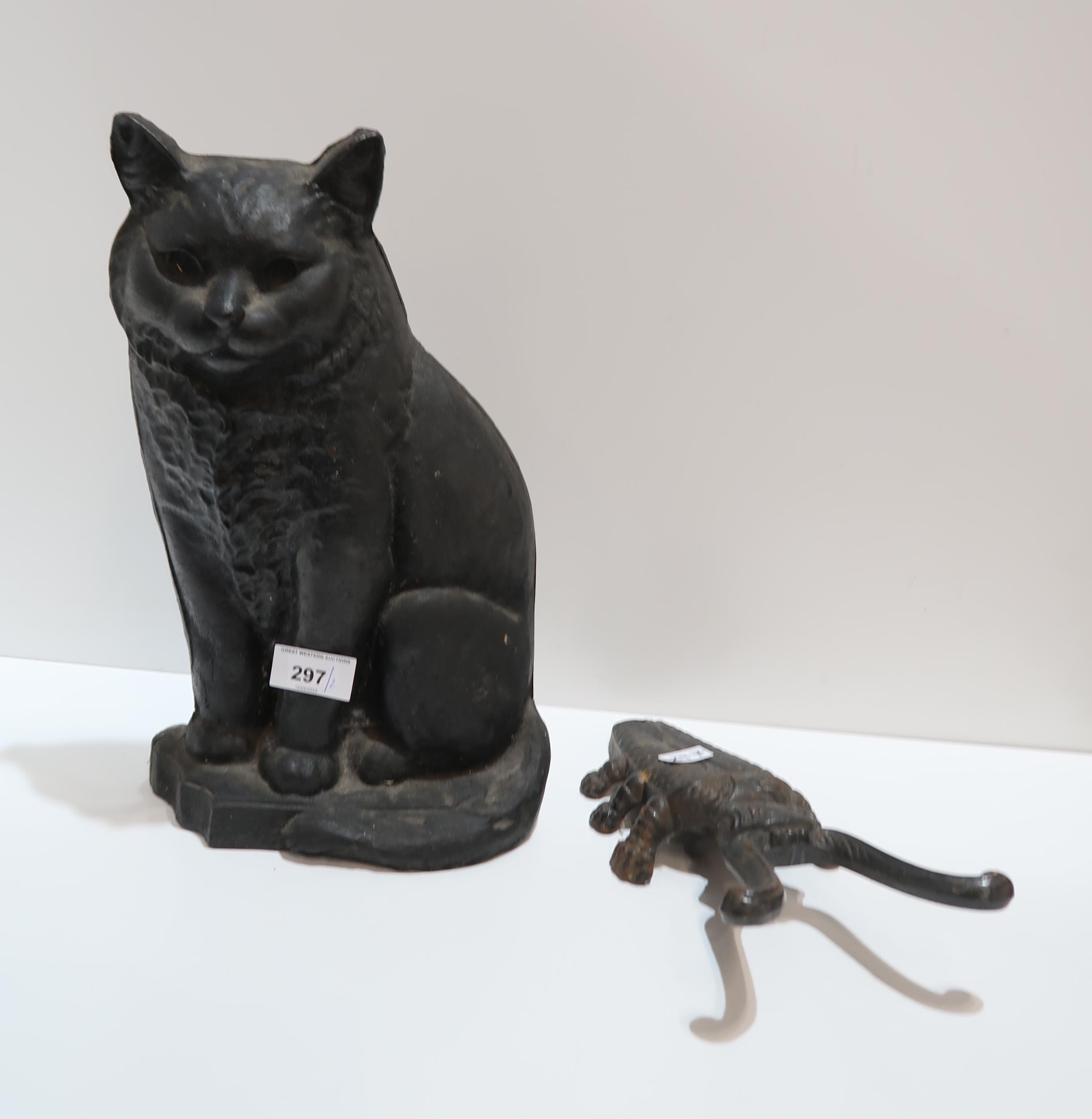 A cast iron cat door stop and a beetle boot jack Condition Report:Available upon request