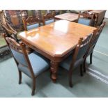 A Victorian oak dining table on turned baluster supports 75cm high x  135cm long x 102cm deep and