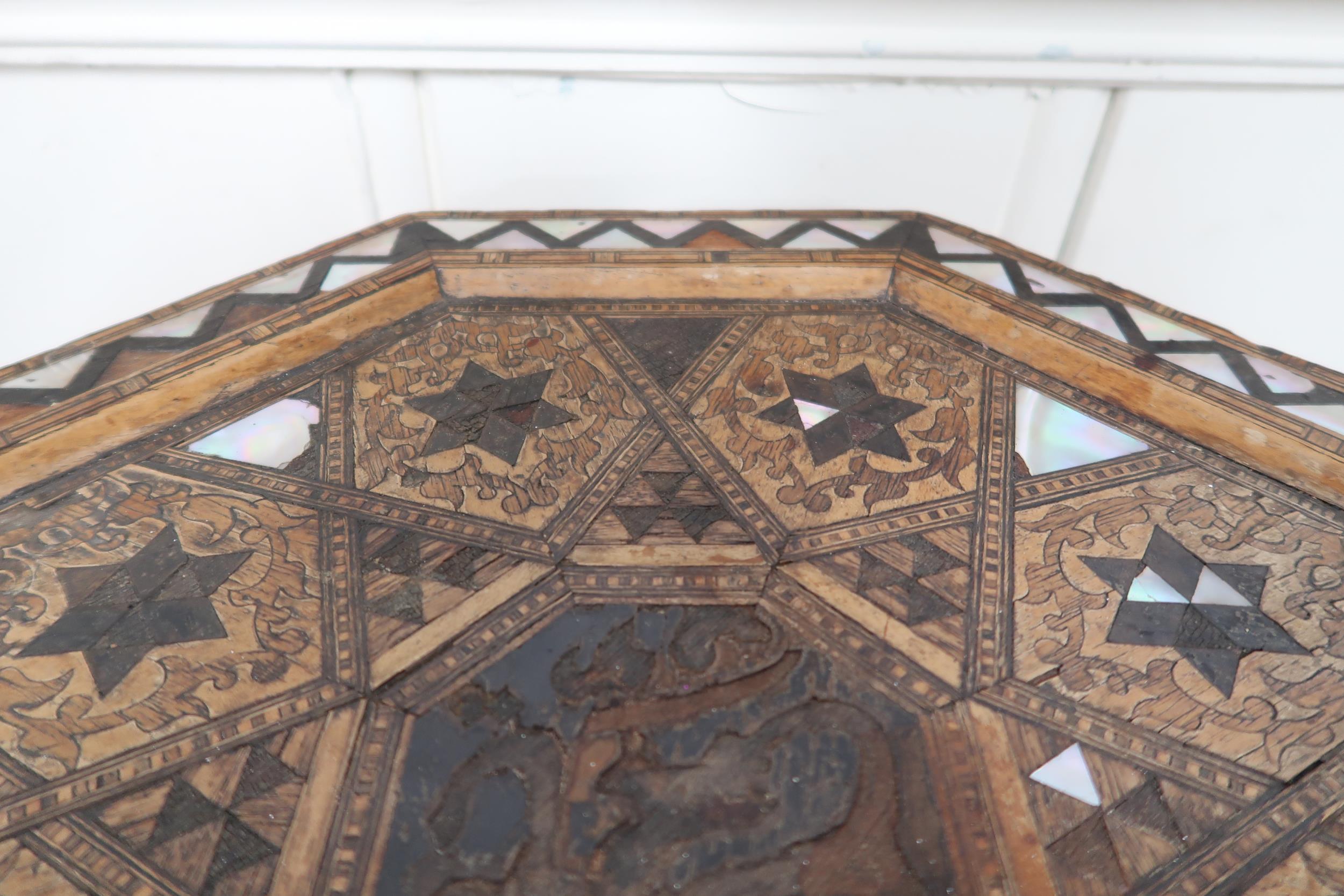 An Anglo-Moorish occasional table in the manner of Liberty & Co with mother of pearl and sample wood - Image 3 of 4