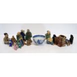 A blue and white teabowl and a collection of assorted figures Condition Report:Available upon