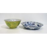 A Chinese yellow ground bowl with green painted decoration together with a Chinese blue and white