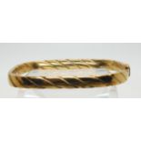 A 9ct gold twist pattern bangle 10.1gms Condition Report:A good quality bangle no damage. Clasp