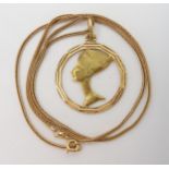 An 18ct gold Nefertiti pendant together with a bright yellow metal herringbone chain the clasp