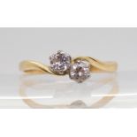 An 18ct gold twin stone diamond ring set with an estimated approx 0.33cts of brilliant cut