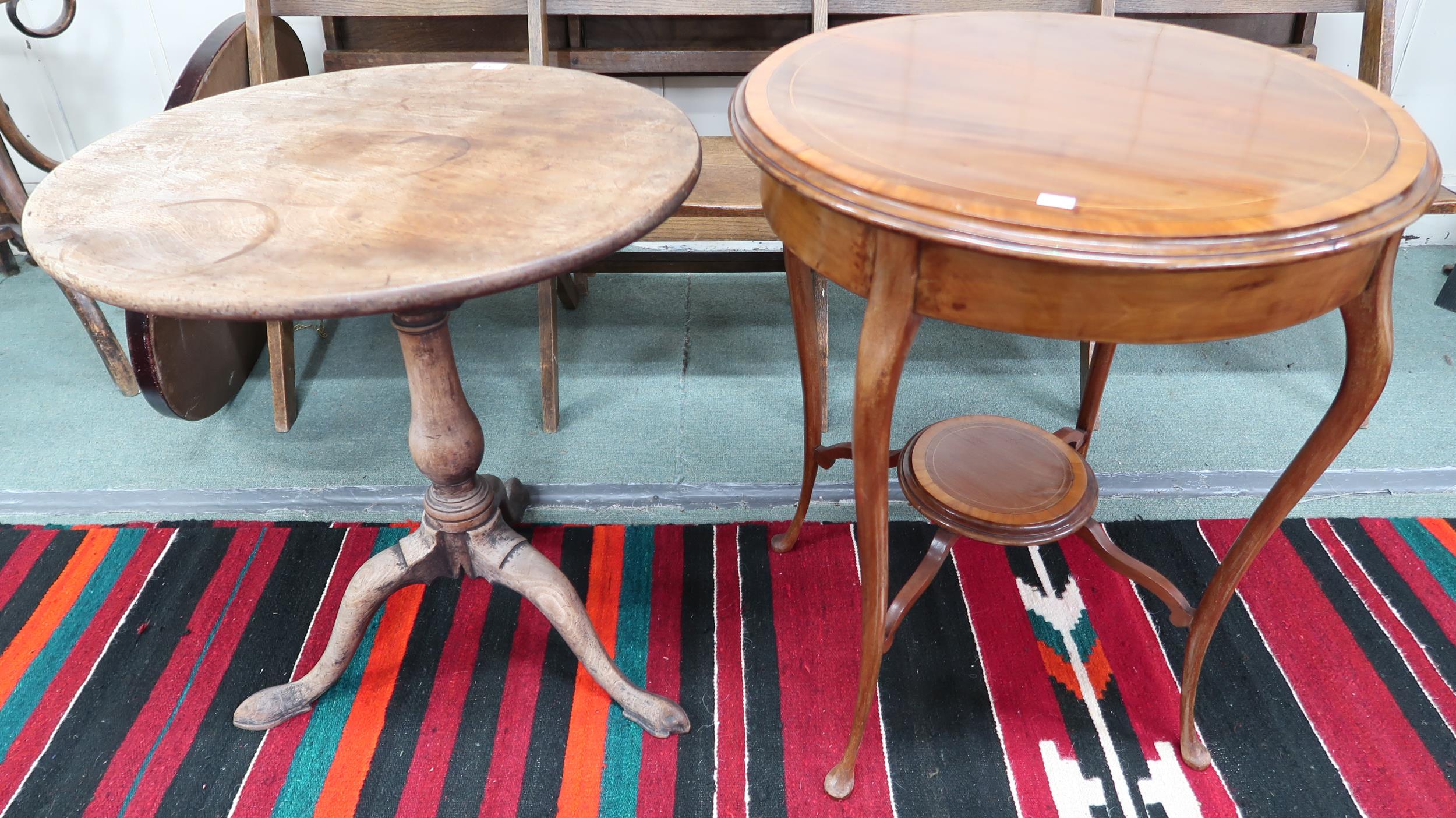 A Victorian circular tilt top table on tripod base and an Edwardian two tier circular occasional