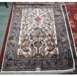 A pair 20th century wool tree of life pattern rugs with floral foliate border, 180cm long x 133cm