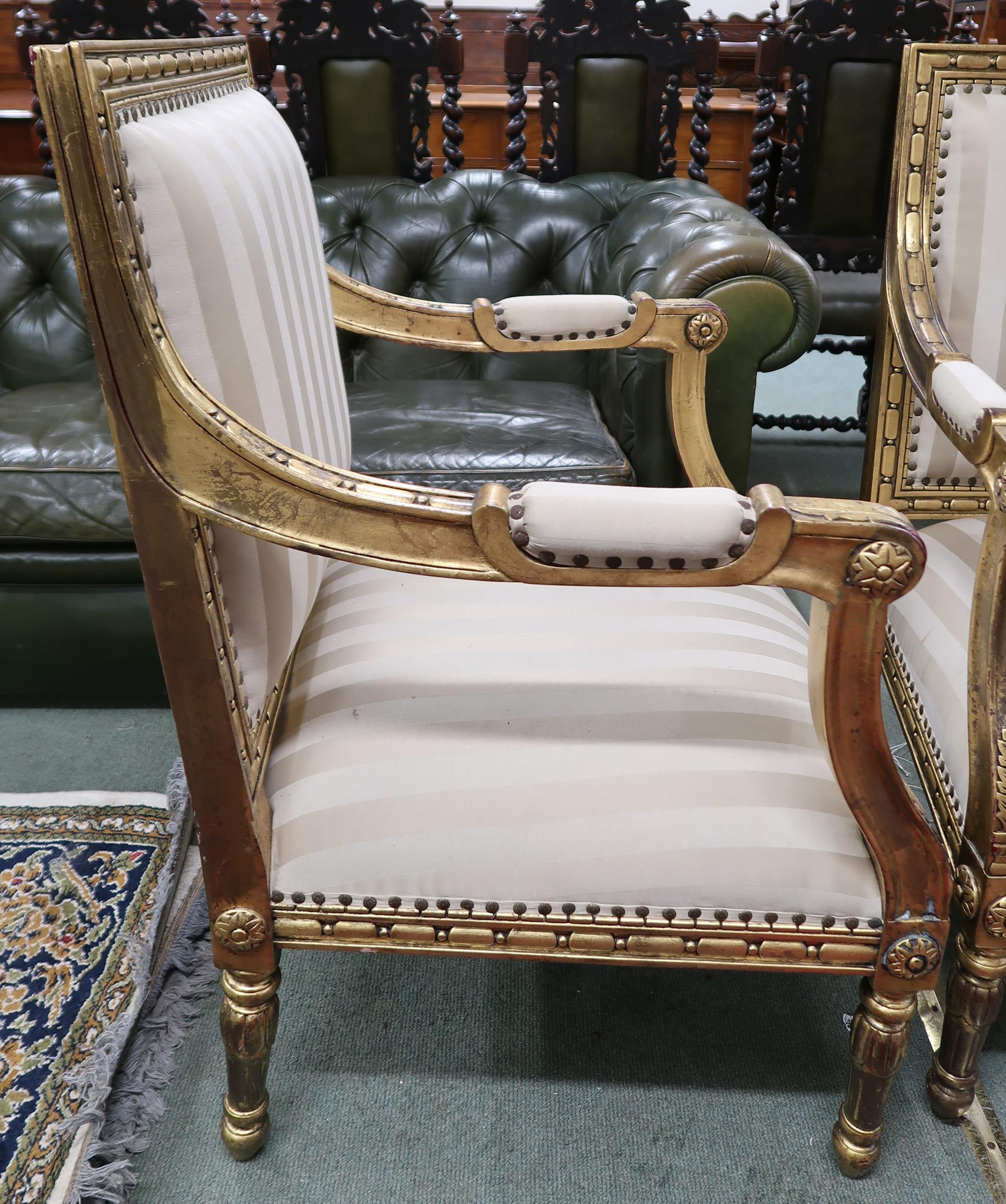 A pair of 20th century gilt framed continental style open armchairs with striped upholstery, 96cm - Image 2 of 3