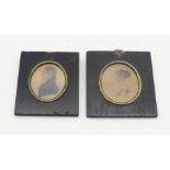 A pair of early-19th century profile portrait miniatures in ebonised frames, identified verso as