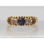 An 18ct gold sapphire and diamond ring (two stones missing) finger size O1/2, weight 3.9gms