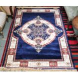 A modern machine made Sarook-Kashan silk rug with cream and beige central medallion and borders on
