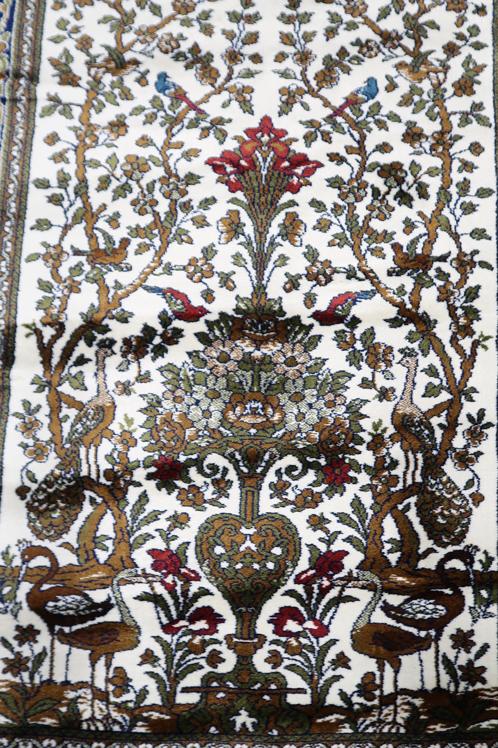 A pair 20th century wool tree of life pattern rugs with floral foliate border, 180cm long x 133cm - Image 5 of 6