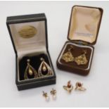 A pair of 9ct gold drop shaped earrings and a further three pairs of 9ct and yellow metal earrings