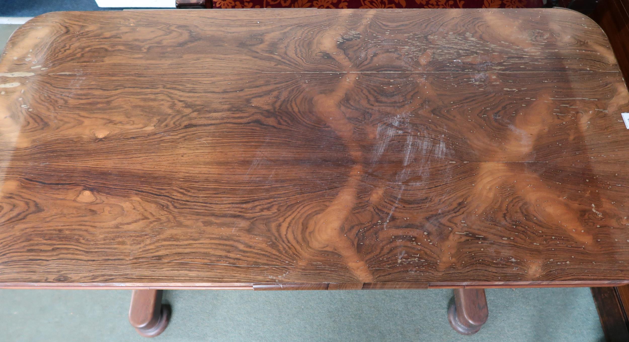 A Victorian rosewood library table with single drawer on octagonal baluster supports on bun feet, - Image 2 of 4