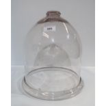 A large glass dome with turned foot Condition Report:Available upon request