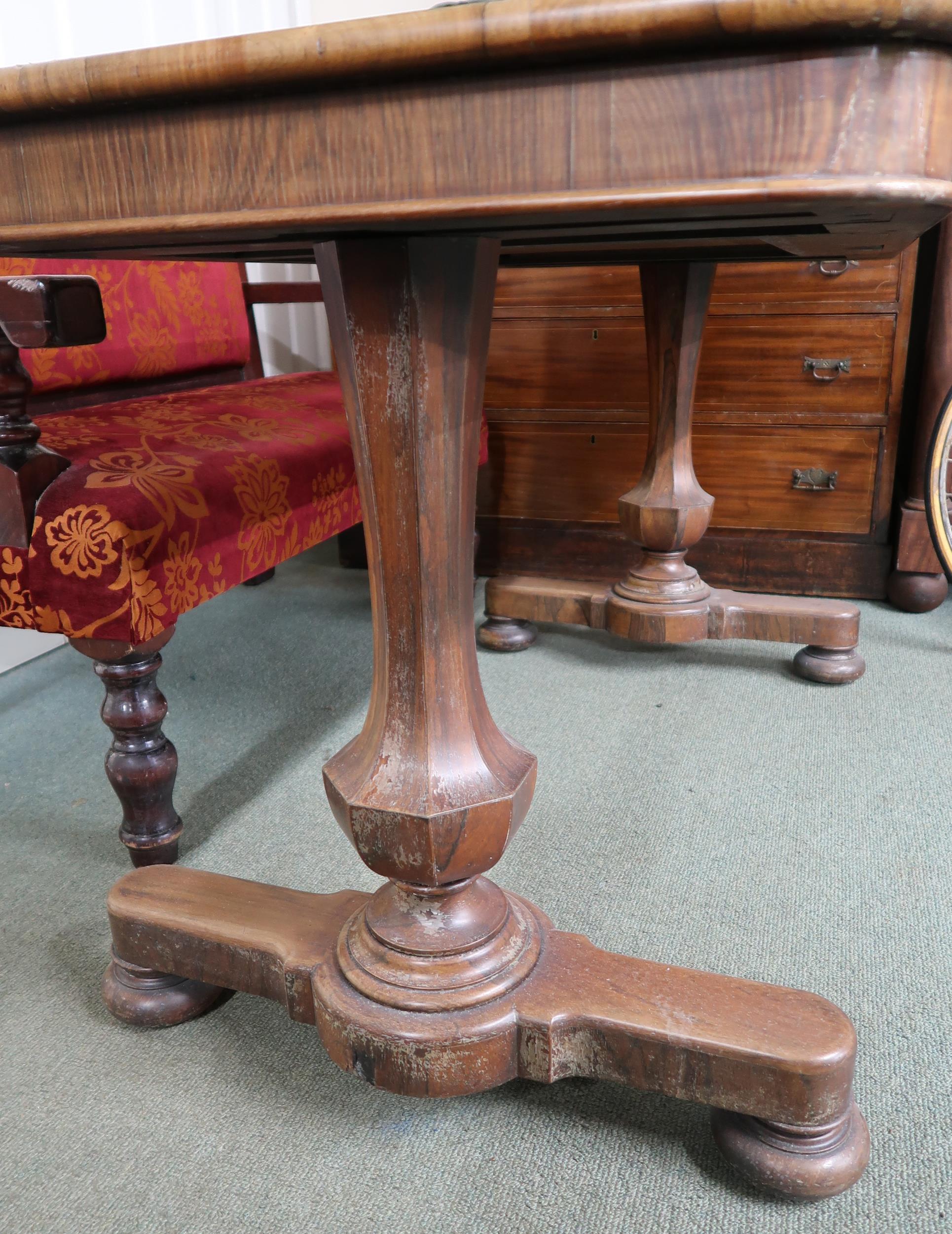 A Victorian rosewood library table with single drawer on octagonal baluster supports on bun feet, - Image 3 of 4