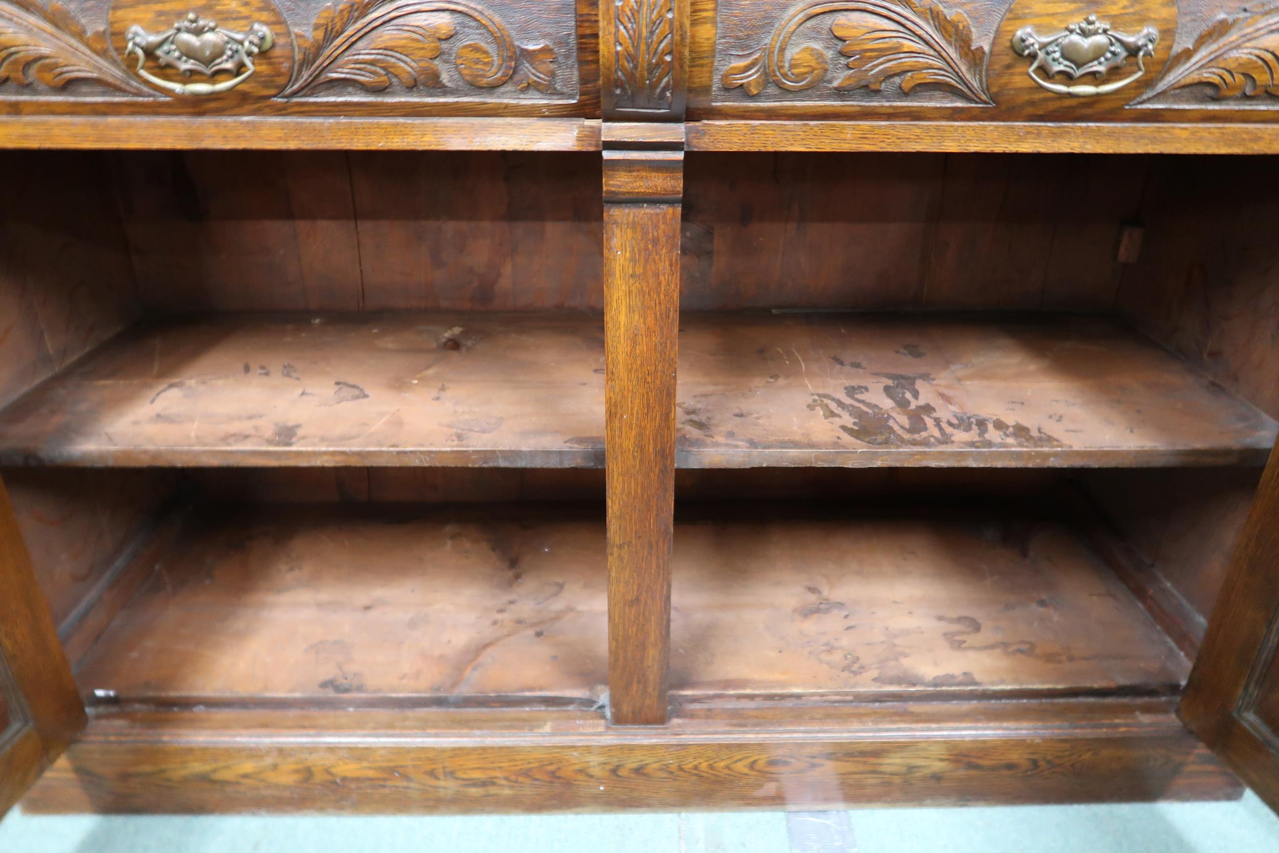 A Victorian oak sideboard with pair of carved drawers over pair of carved doors on plinth base, 99cm - Image 2 of 3