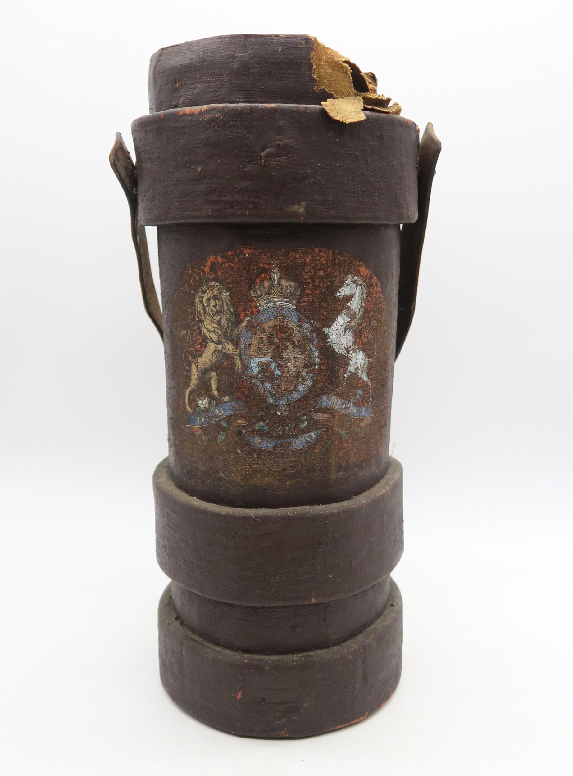 An artillery shell carrier, constructed from painted canvas over a cork base, measuring approx. 46cm