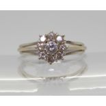 An 18ct white gold diamond flower cluster ring, set with estimated approx 0.25cts of brilliant cut