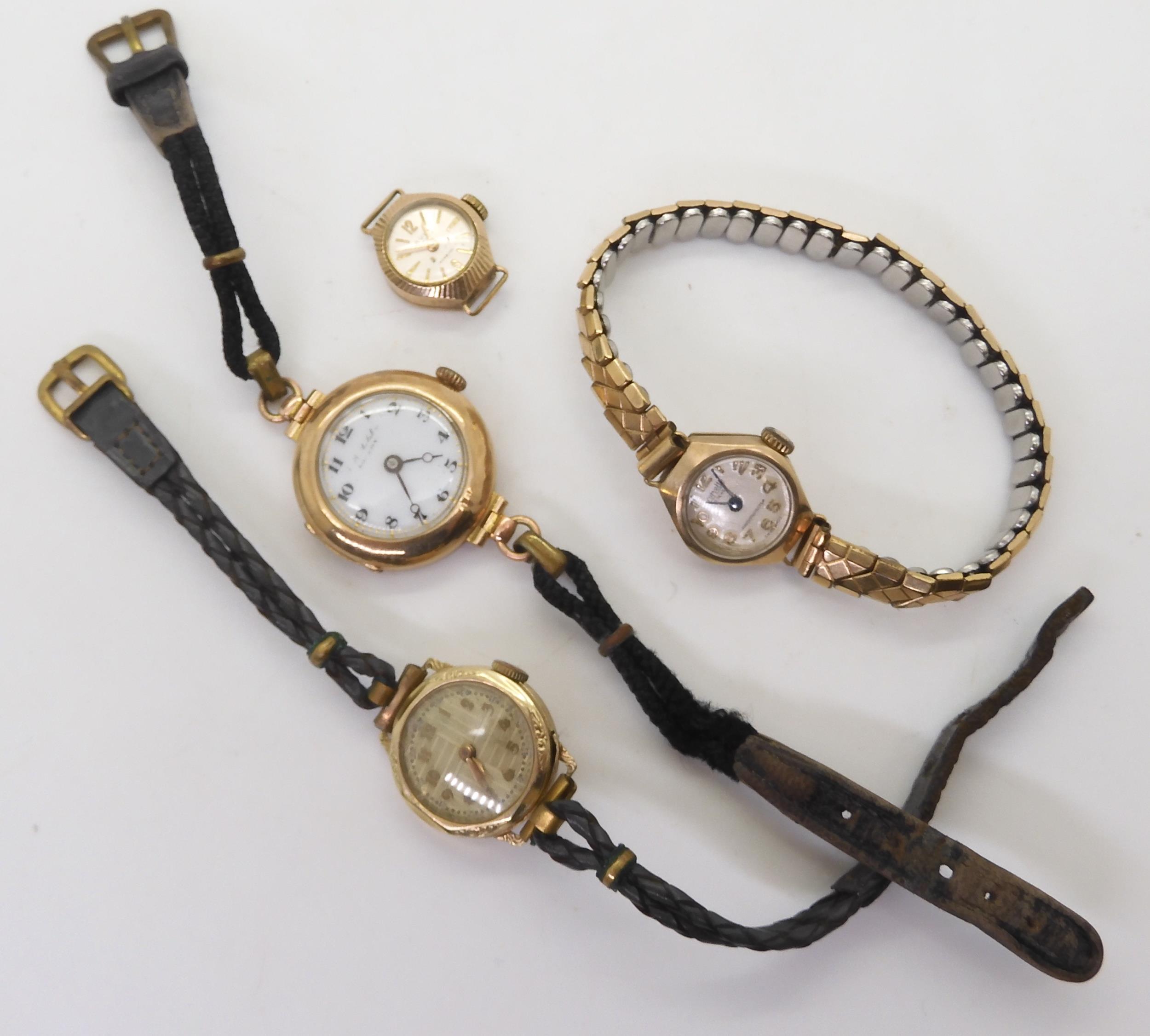 A 14k gold cased ladies watch with leather strap, weight together including mechanism 14gms, and
