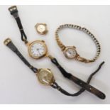 A 14k gold cased ladies watch with leather strap, weight together including mechanism 14gms, and