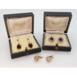 A pair of 9ct gold garnet and pearl earrings, a pair set with amethyst and pearls, weight together