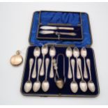 A collection of silver including a cased set of silver tea spoons and sugar tongs, by Martin