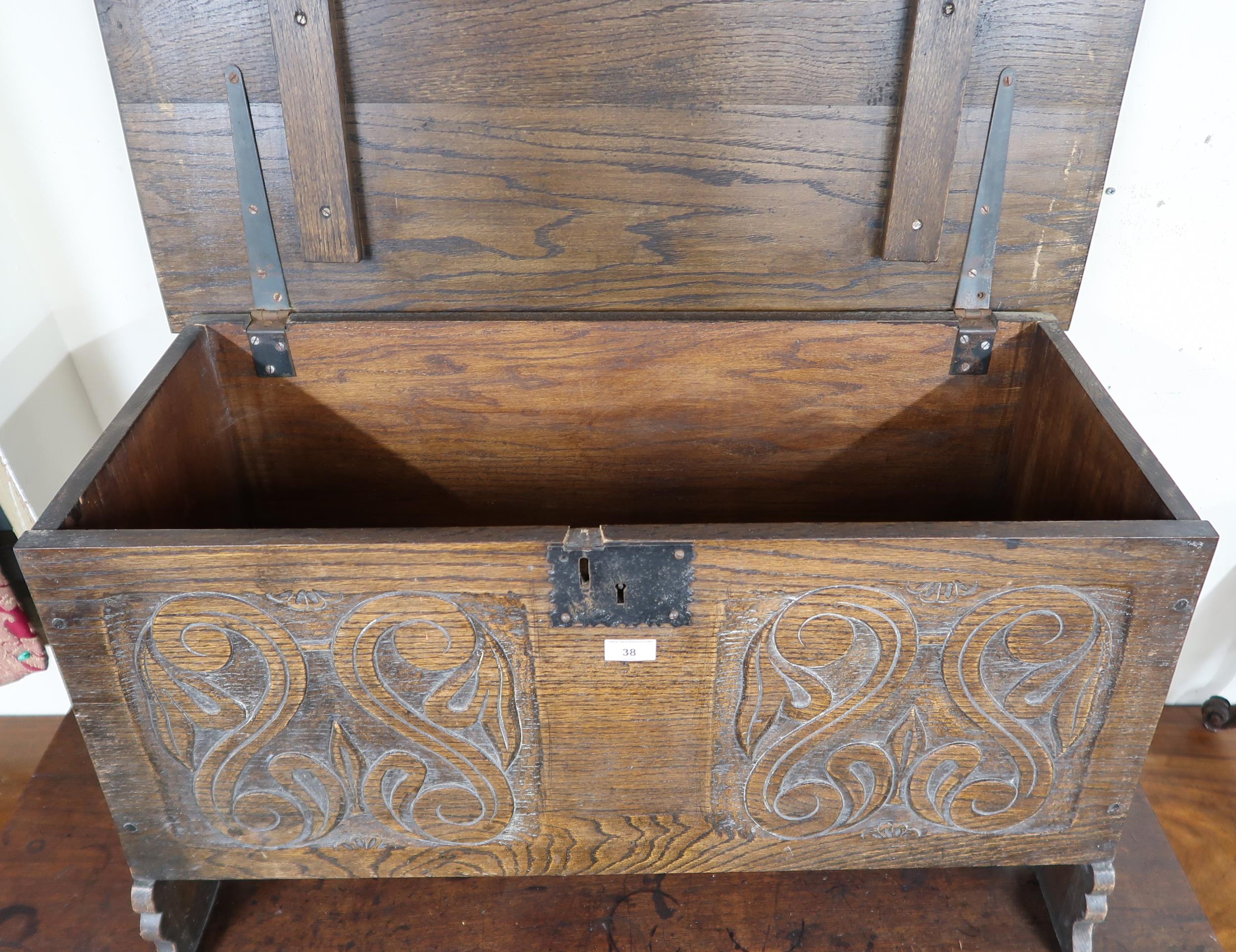 A 20th century oak kist with carved front panel, 56cm high x 91cm wide x 42cm deep Condition - Image 4 of 4